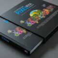 Una foto di The Unofficial GBA Pixel Book, fotografato parzialmente estratto dal suo cofanetto di cartone.